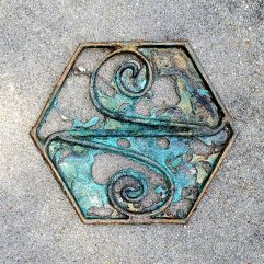 Fine art wall hanging metal sculpture for sale. Sand cast bronze filigree with an antiqued blue green patina. Abstract concept art with a unique story. The symbol of The Sketh inside a geometric hex shape. This Sigil is from the introductory chapters of the Helstrom Universe. Visit www.WEIRDrpg.com to learn more and interact in the gaming metaverse.