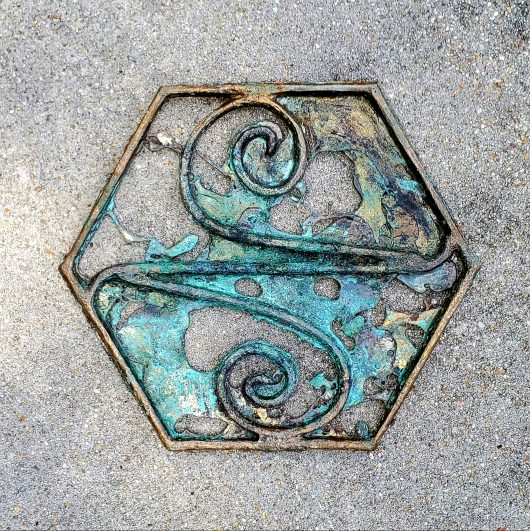 Fine art wall hanging metal sculpture for sale. Sand cast bronze filigree with an antiqued blue green patina. Abstract concept art with a unique story. The symbol of The Sketh inside a geometric hex shape. This Sigil is from the introductory chapters of the Helstrom Universe. Visit www.WEIRDrpg.com to learn more and interact in the gaming metaverse.